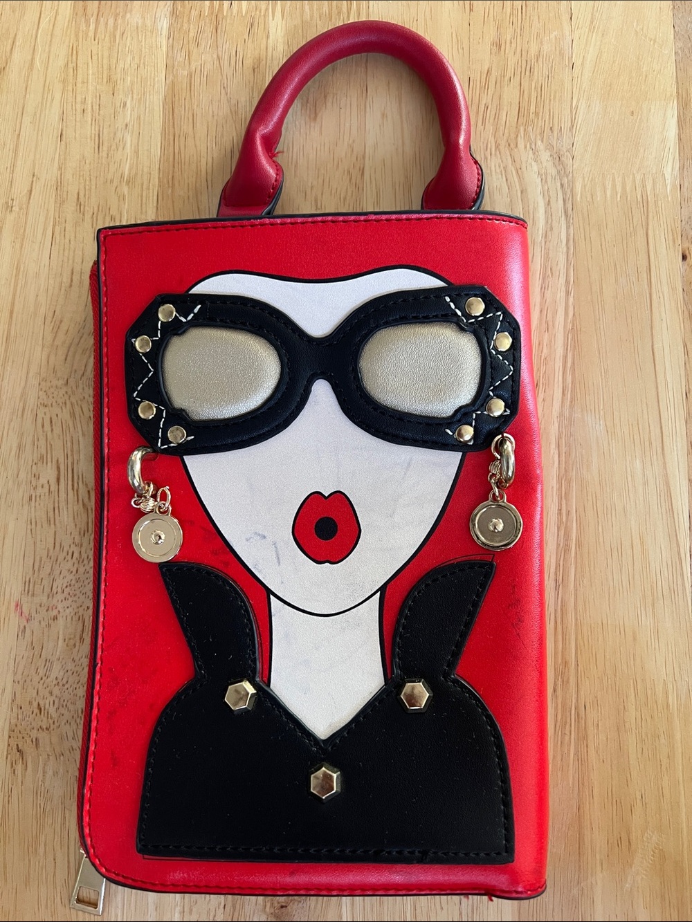 Eclectic original red handbag with gold hardware.